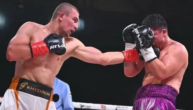 Boxer delivering a punch during a match