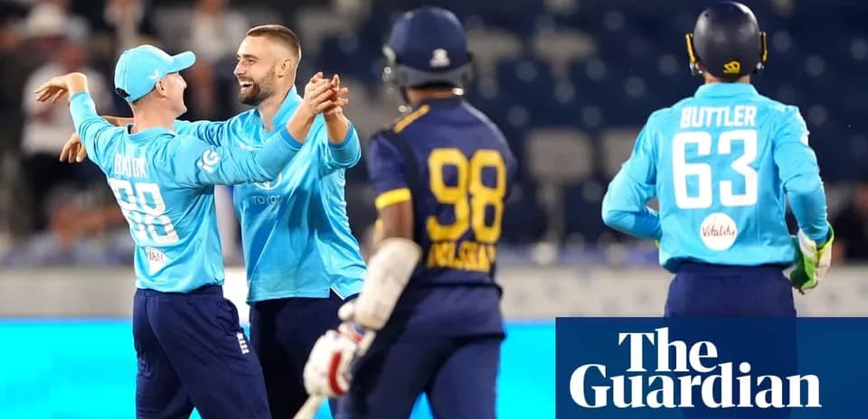 England players celebrating after taking a wicket