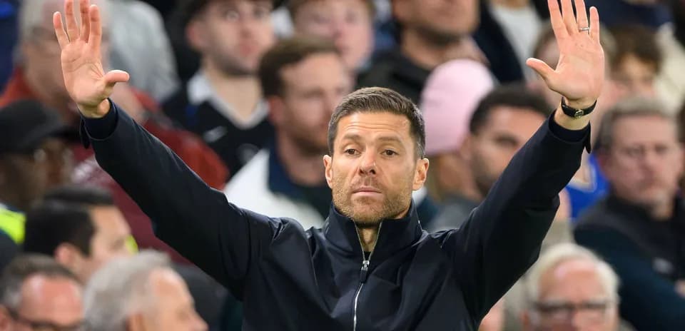 Coach signaling during a football match on sidelines