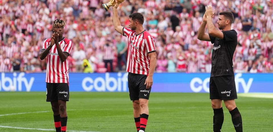 Players celebrating with trophy during match event