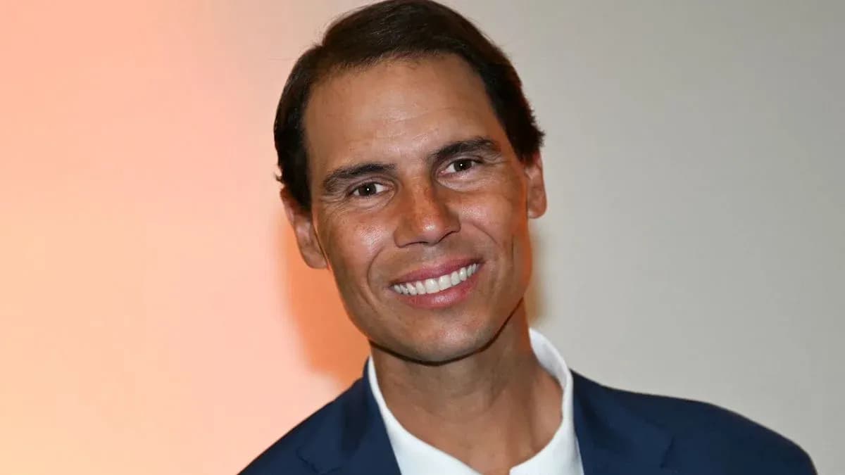 Smiling man in a suit with a light background