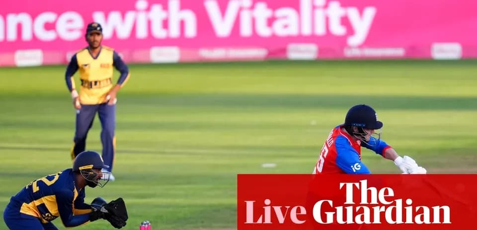 Cricketer batting while wicketkeeper prepares to catch