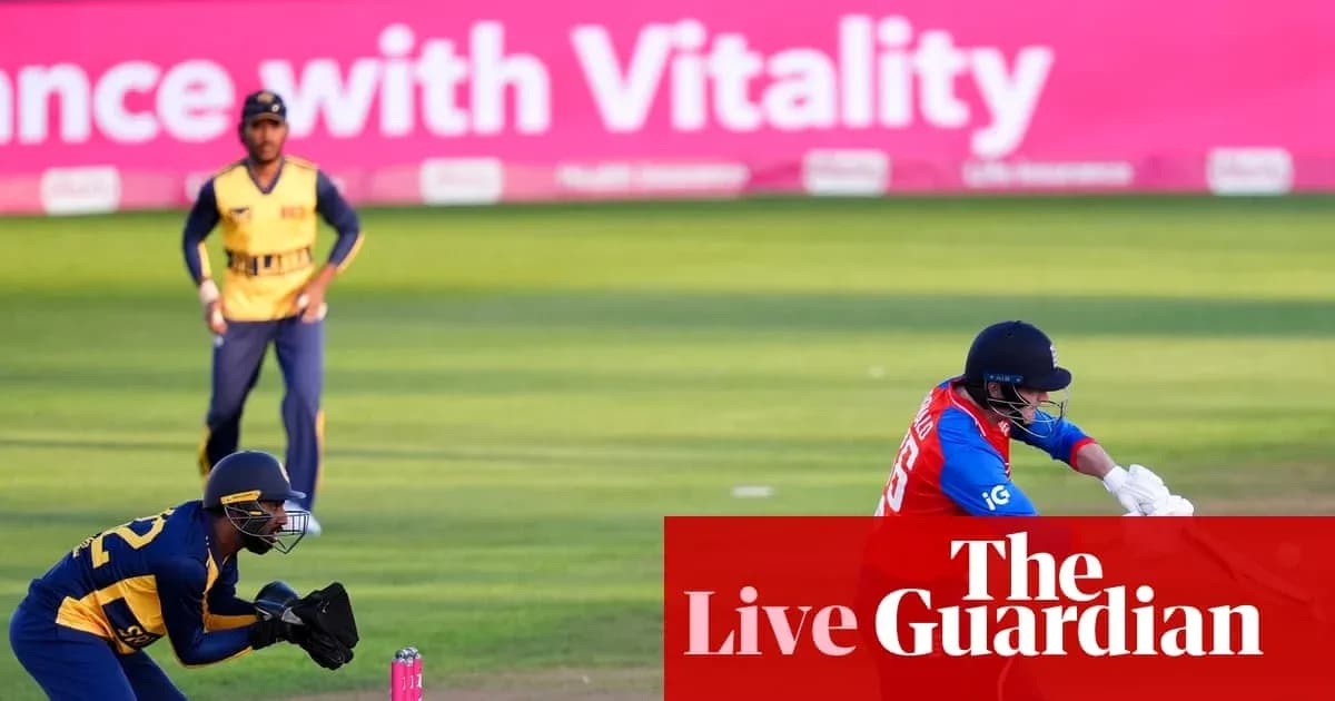Cricketer batting while wicketkeeper prepares to catch
