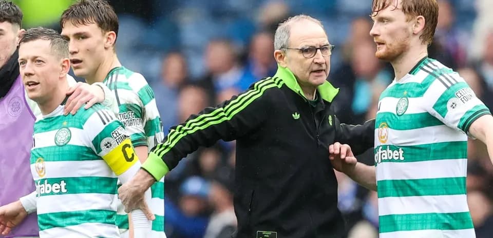 Celtic players and manager interacting on the pitch