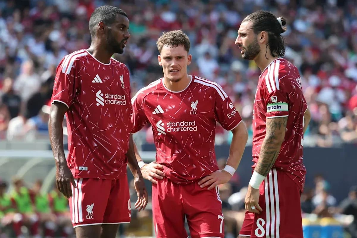 Liverpool players discussing strategy during match