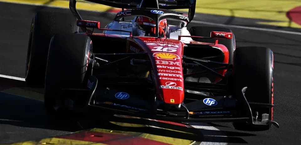 Ferrari Formula 1 car racing on track corner