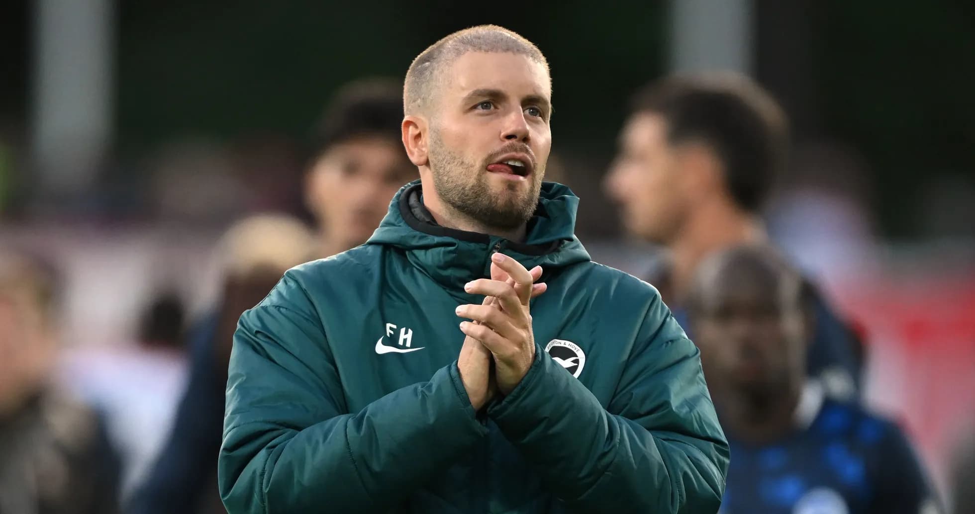 Coach applauding during a training session