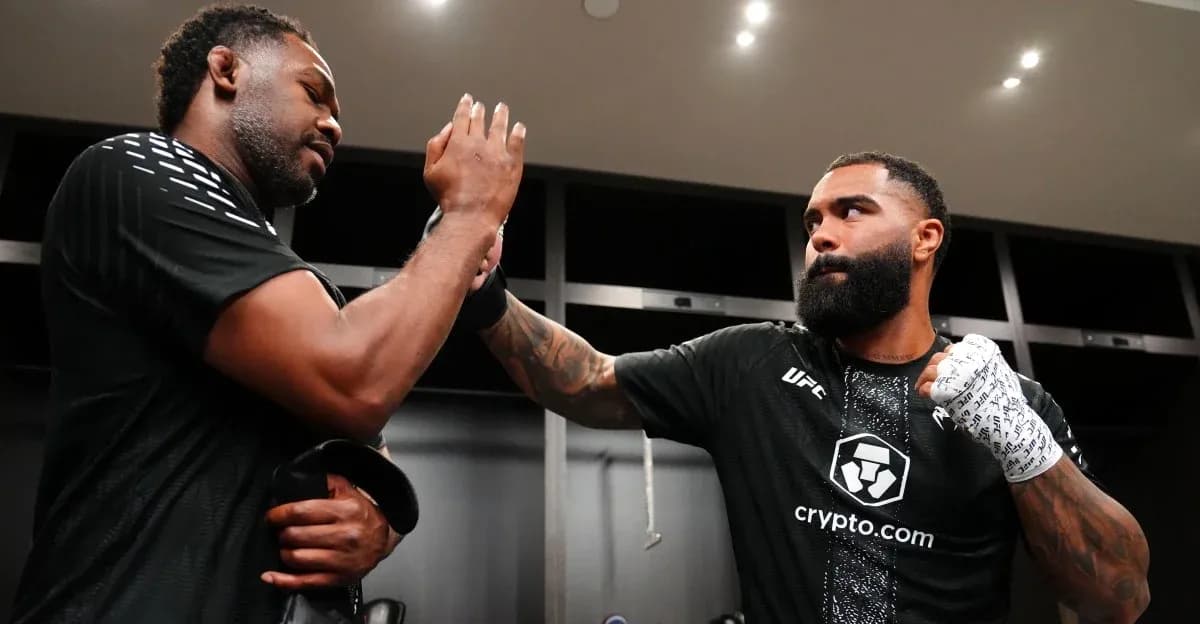 Two fighters exchanging a fist bump in locker room