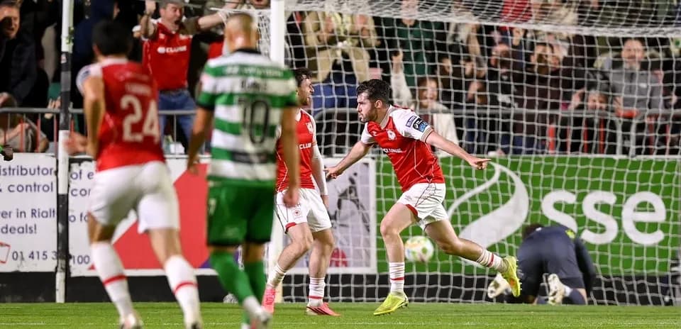Player celebrating goal with teammates in match
