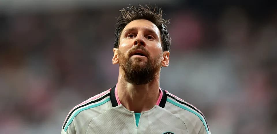 Player in Miami jersey looking upwards on field