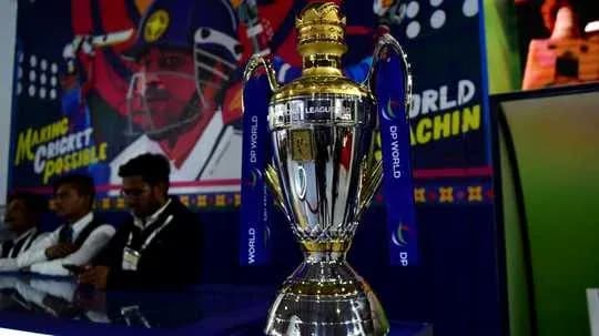 Trophy on display with cricket-themed background