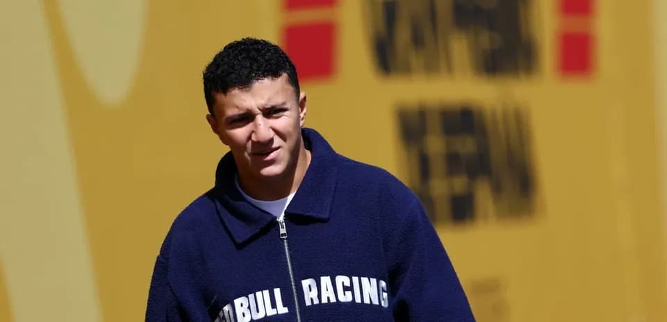 Driver wearing Red Bull Racing jacket at venue