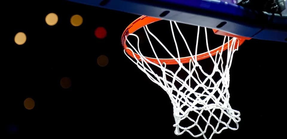 Basketball hoop against a dark background
