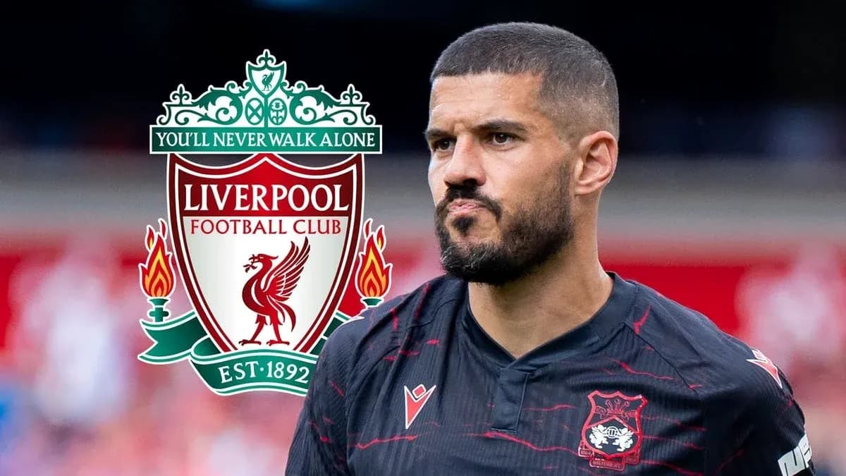 Player in Liverpool kit with club logo background