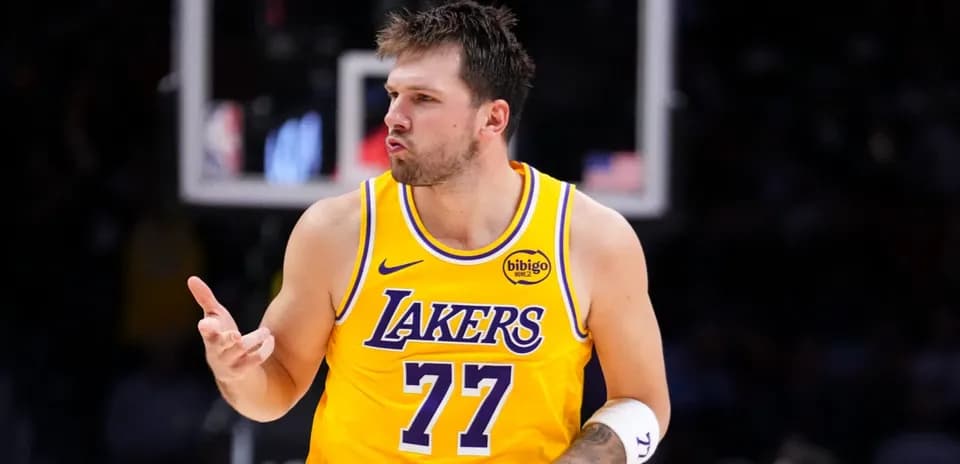 Player celebrating in Lakers jersey during game