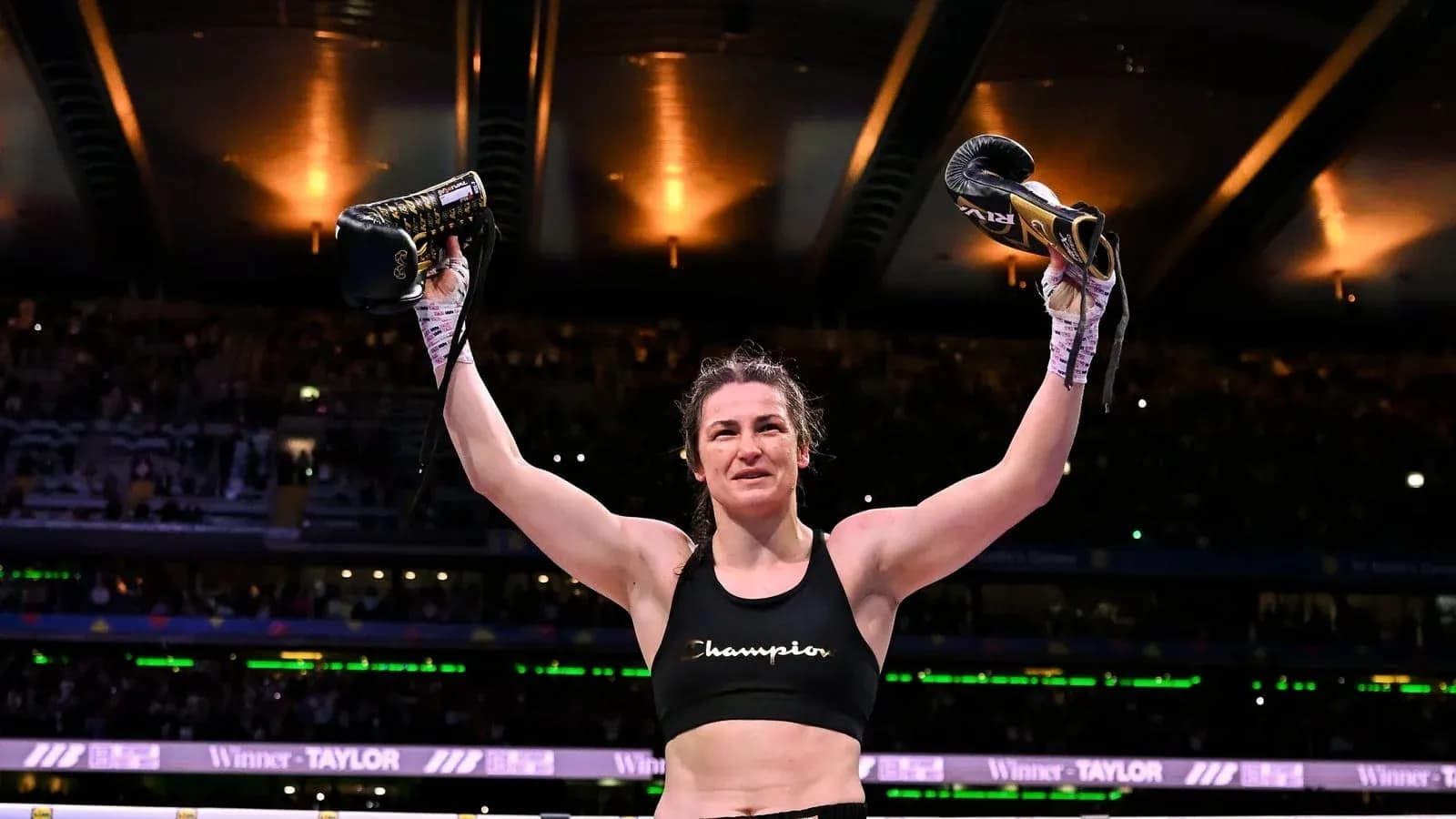 Boxer celebrating victory with gloves raised