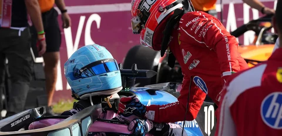 Drivers interacting after a race incident in pit area