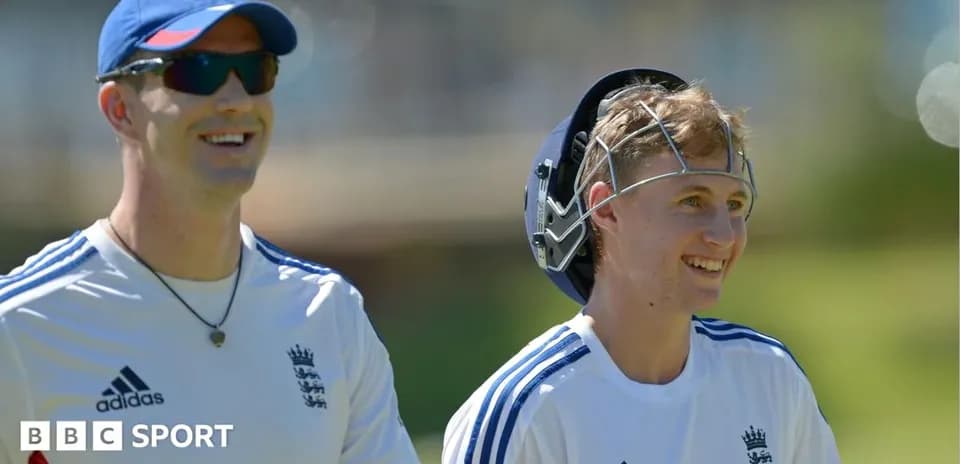 Two cricket players smiling during practice session