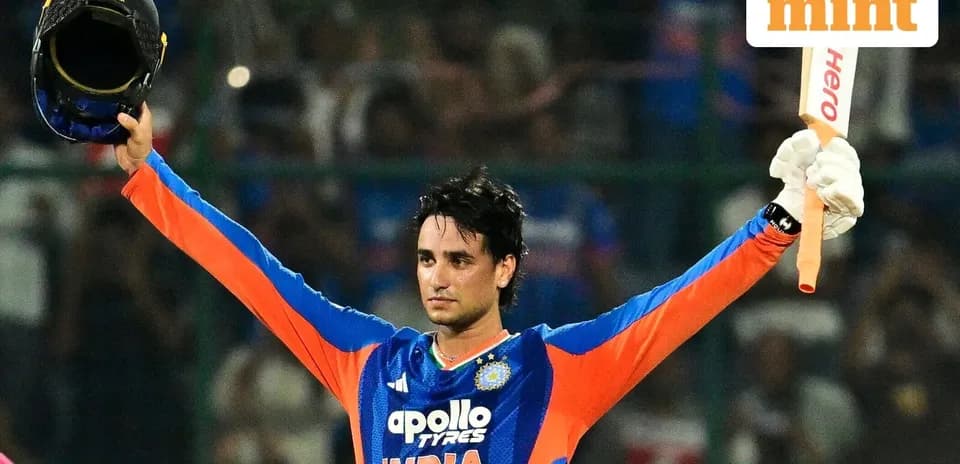 Cricketer celebrating after scoring a century
