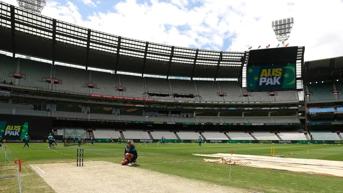 Players warming up at cricket ground before match