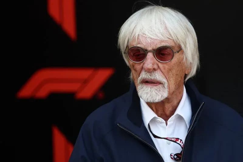 Man with white hair and glasses at F1 event