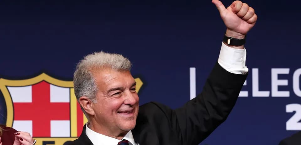 Man raising thumb during press conference at podium