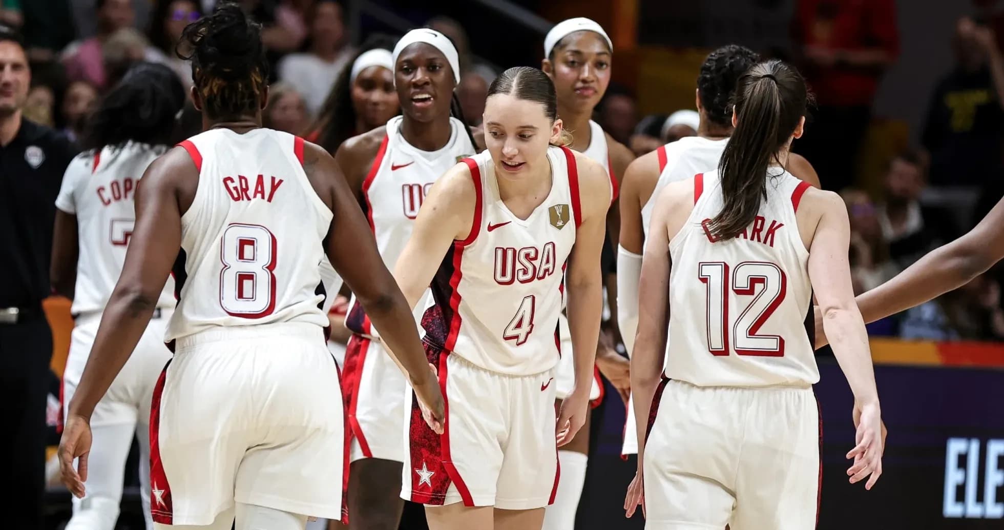 USA women's basketball team celebrating on court