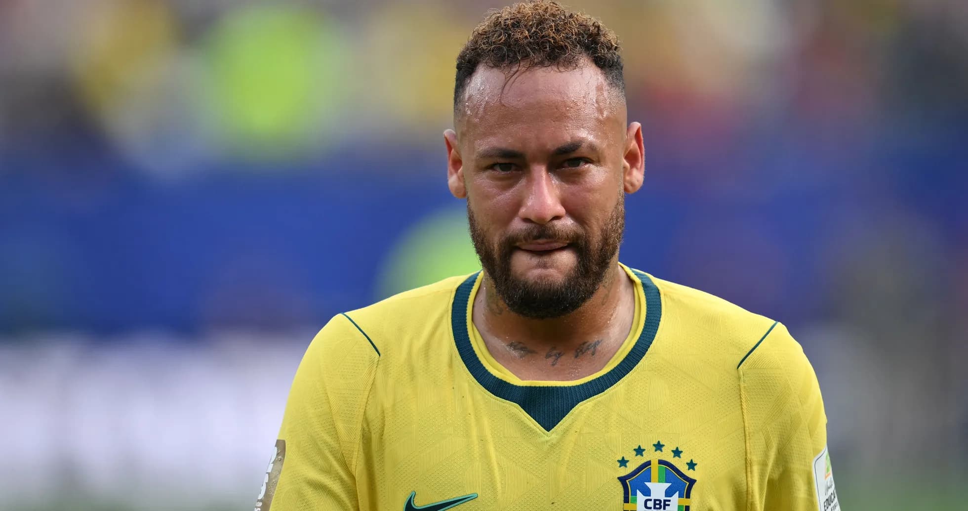 Neymar walking off field in Brazil jersey
