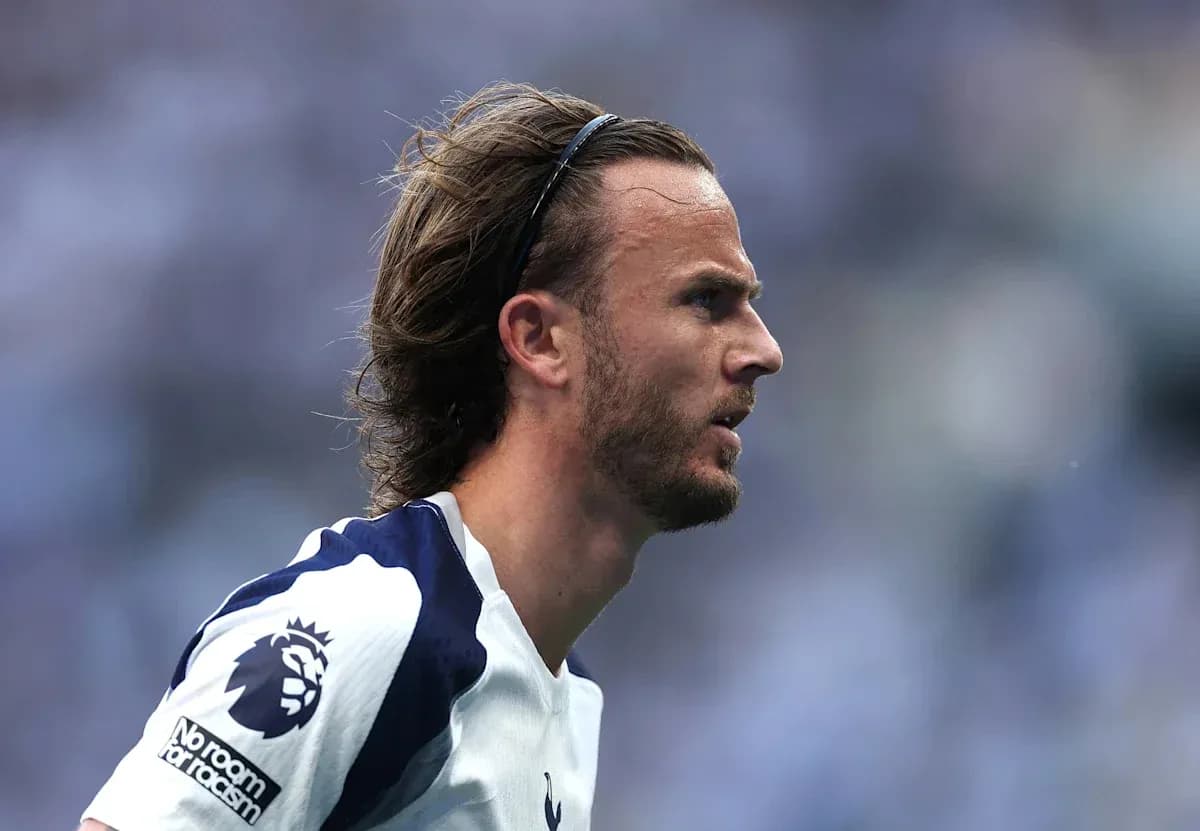 Player in Tottenham jersey during match action