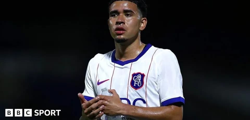 Player in FC shirt holding water bottle
