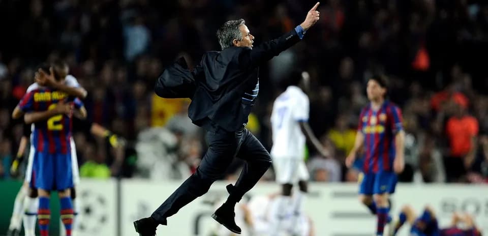 Manager celebrating a goal during a match