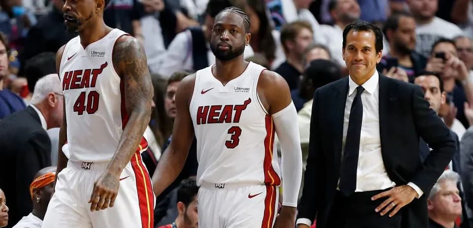 Miami Heat players and coach during game timeout
