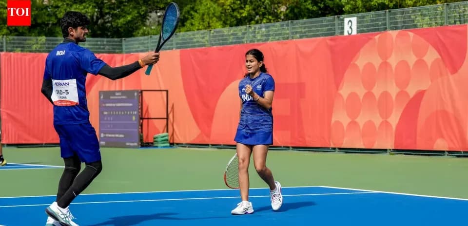 Two tennis players celebrating on the court