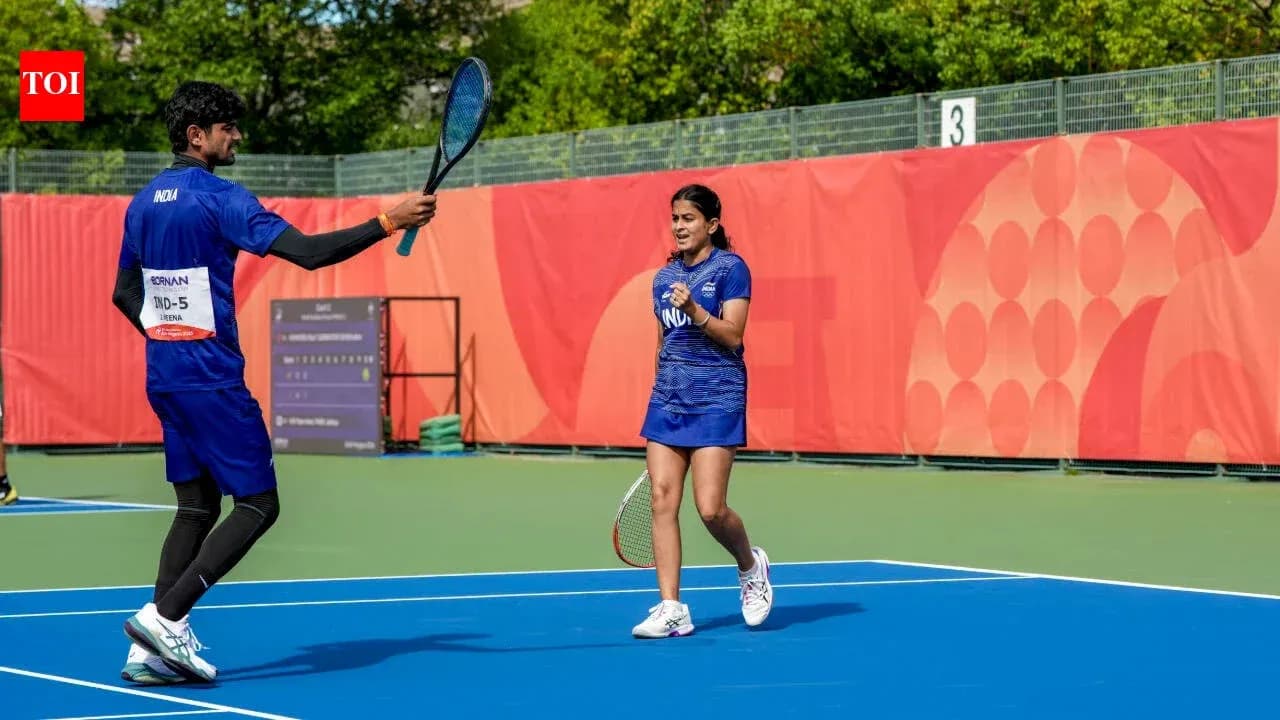 Two tennis players celebrating on the court