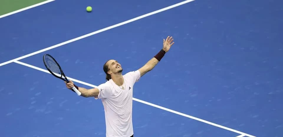 Tennis player celebrating after winning a point