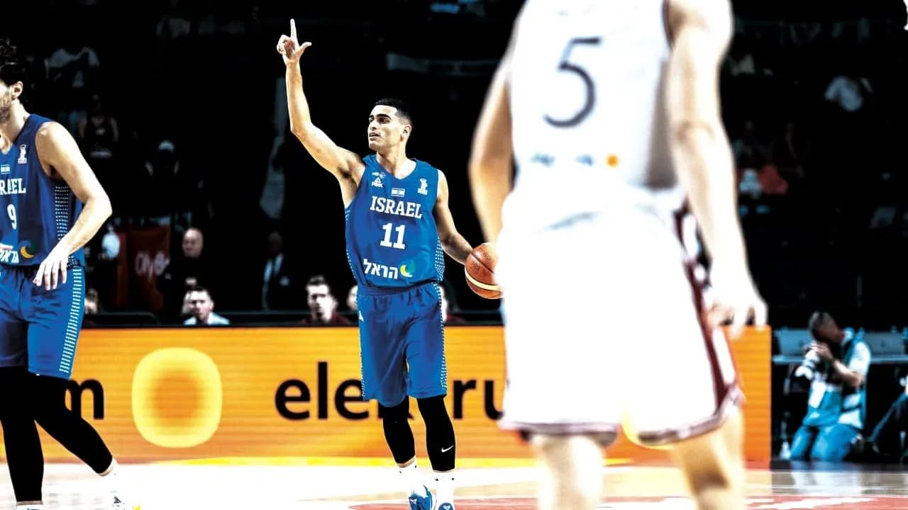Player 11 from Israel signaling during basketball game