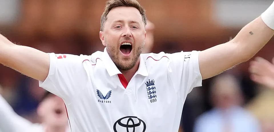 Cricketer celebrating a wicket in white jersey
