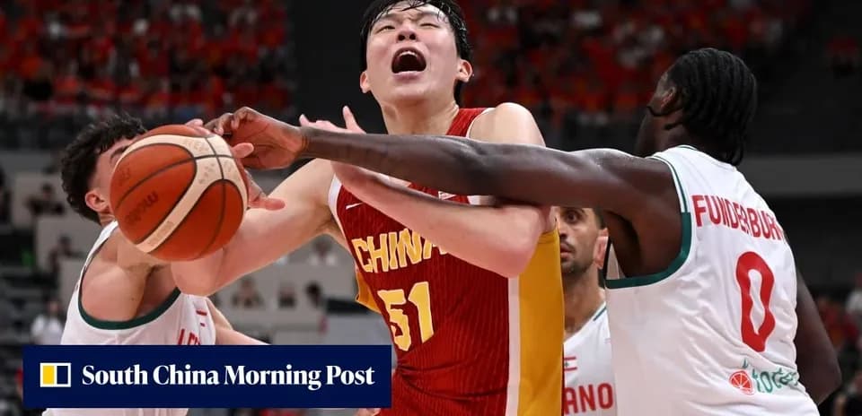 Chinese player contested by two defenders during game