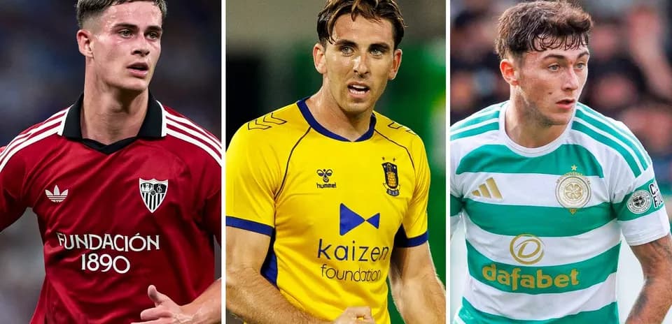 Three football players in team kits on the field
