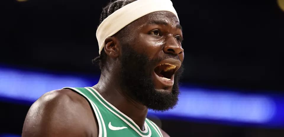 Player in green jersey reacting during basketball game