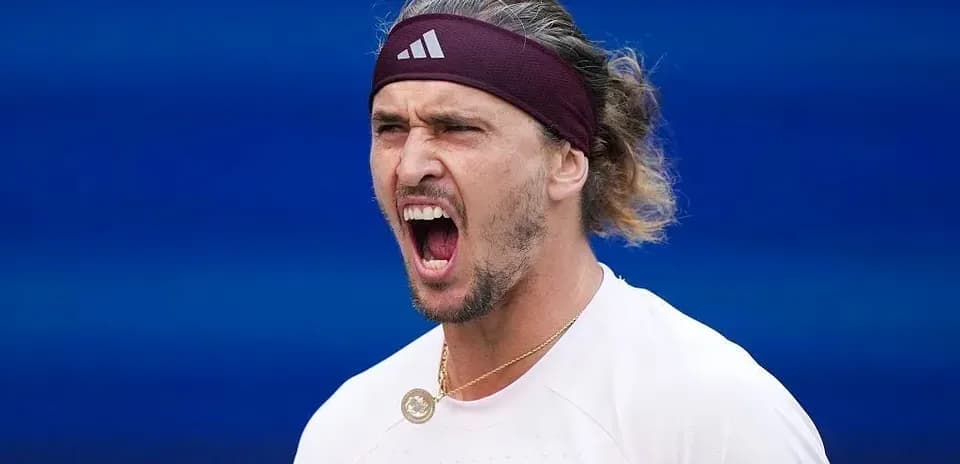 Tennis player celebrating during match action