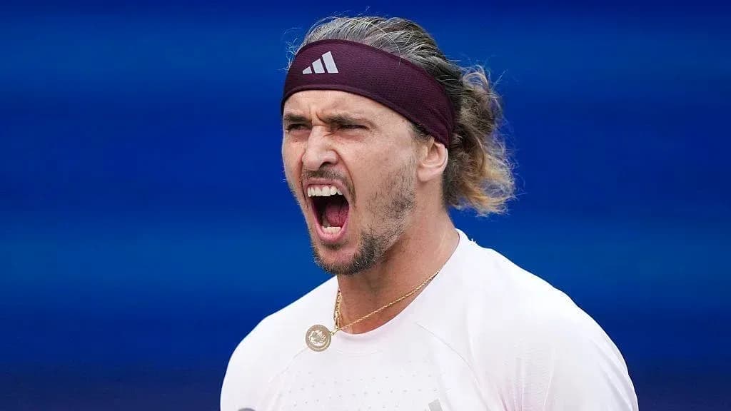 Tennis player celebrating during match action