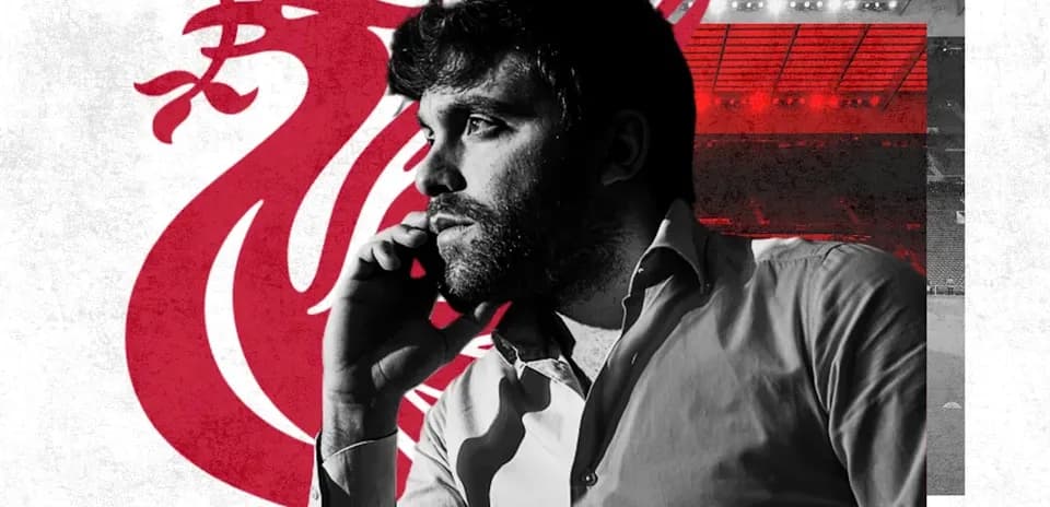 Man on phone with Liverpool logo background