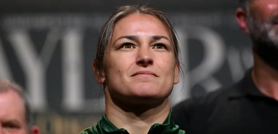 Athlete at weigh-in event wearing green jacket