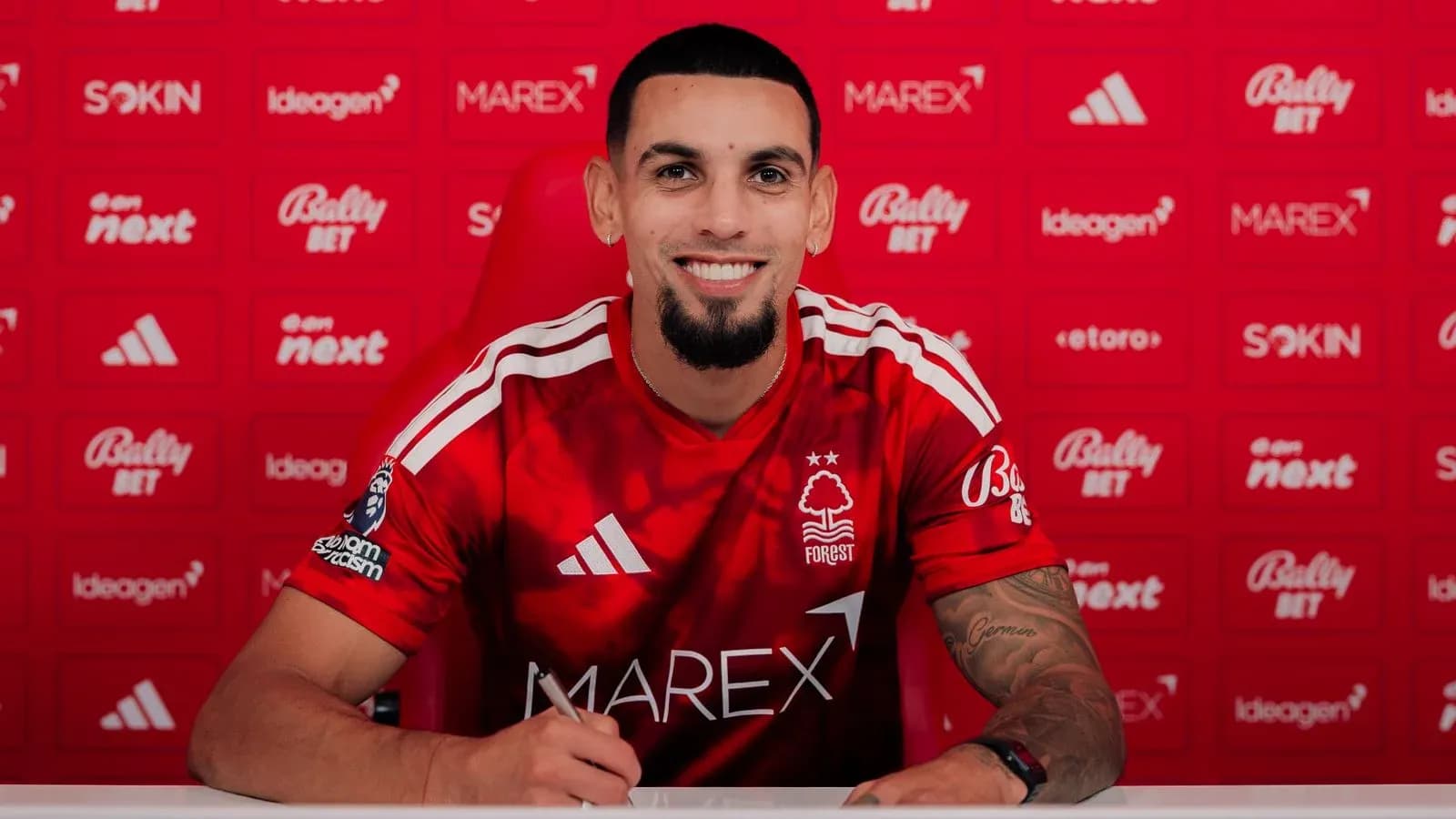 Player signing contract at Nottingham Forest press event
