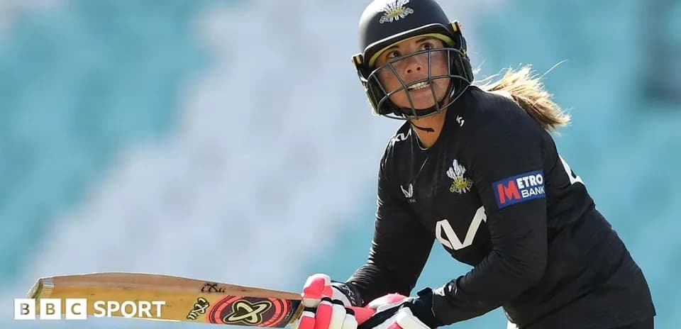 Cricketer preparing to bat on the field