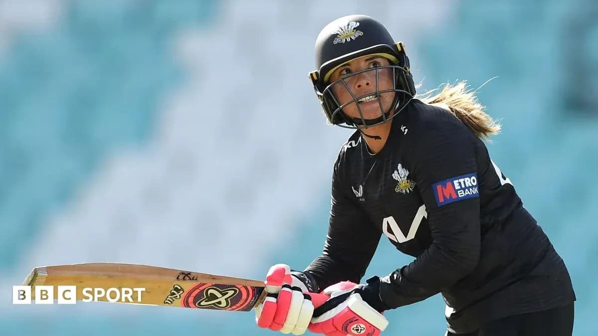 Cricketer preparing to bat on the field