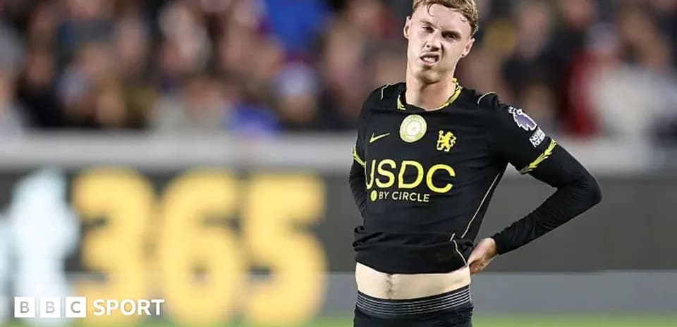 Player adjusting shirt during match on the field