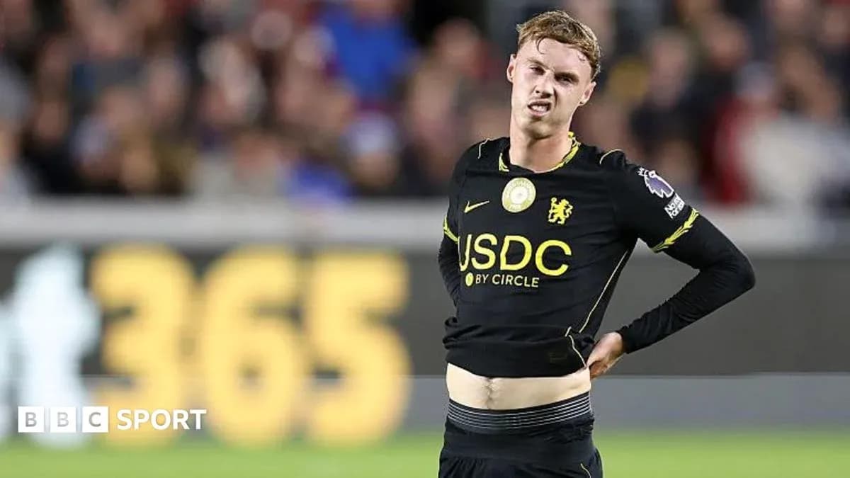 Player adjusting shirt during match on the field