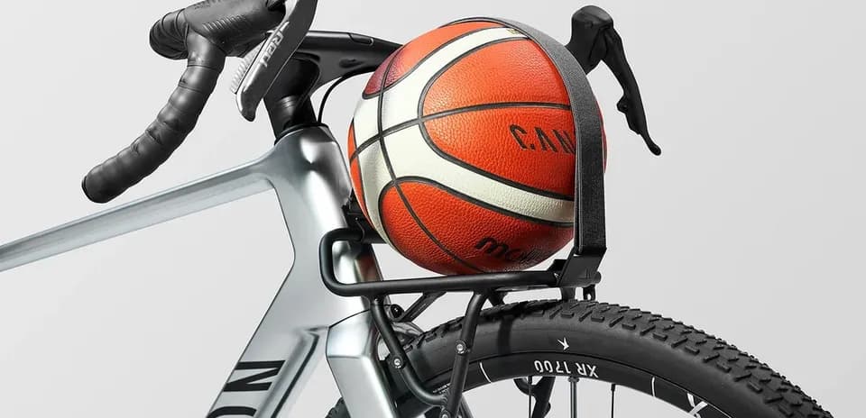 Basketball secured on bicycle's rear rack